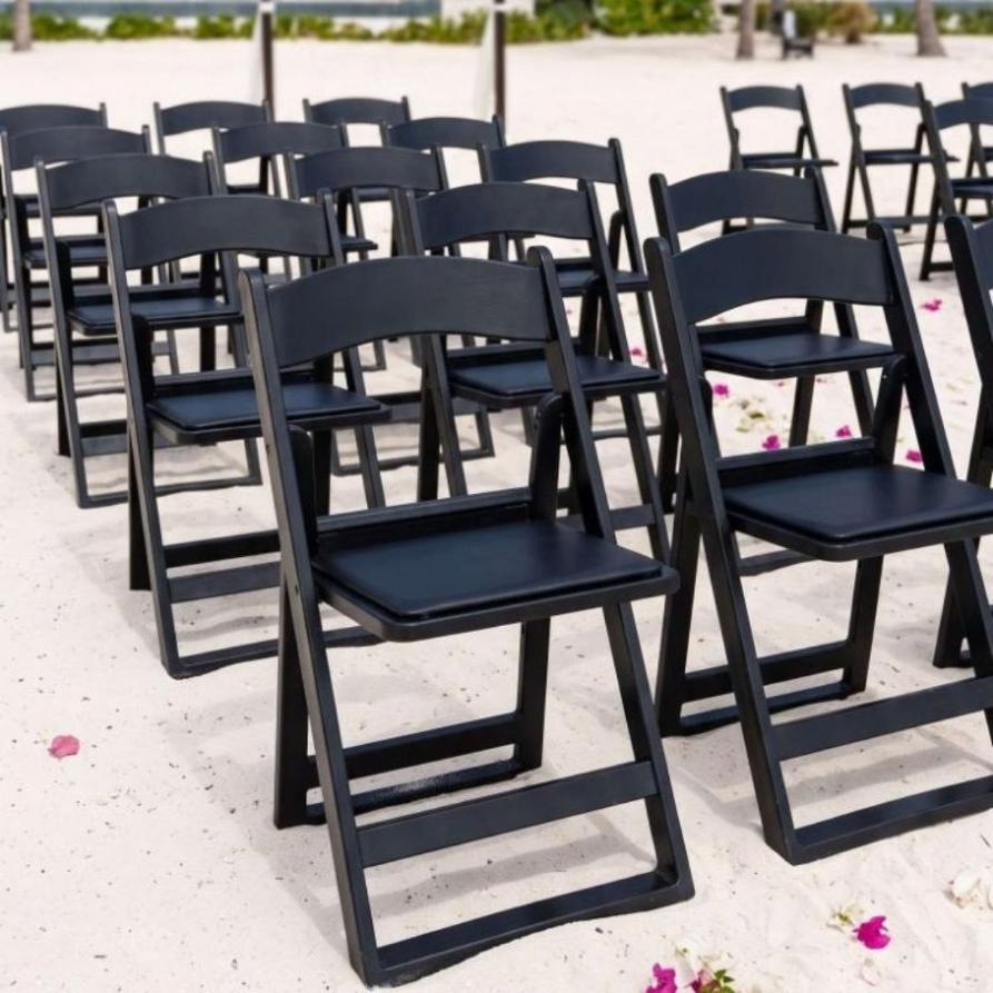 Chair feet detail on grass and sand